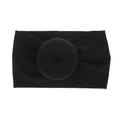 Dettaglio di una morbida fascia per neonati in nylon nero con un nodo a ciambella alla moda - Nero