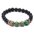 Bracciale in pietra lavica con pietre verdi e ciondoli a corona in oro rosa - Pietra Lavica Nera e Pietra Macchiata Verde (Corona in Oro Rosa)