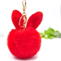 Close-up of red bunny ear pompom keychain with golden metal ring and soft texture - 8cm Pom Pom + Rabbit Ears / Red