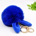 Detailed view of blue plush pompom keychain with rabbit ears and golden metal clasp - 8cm Pom Pom + Rabbit Ears / Blue