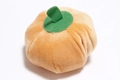 Close-up of soft plush orange pumpkin toy for dogs with green stem and high-quality texture - Pumpkin