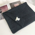 Short dark gray 100% cashmere knitted scarf with a minimalist ribbed edge and soft texture - Black