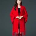 Elegant red winter poncho wrap in mink-like knit fabric with decorative fringe details - Red