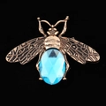 Bronze-tone alloy bee charm featuring a large faceted blue gemstone in a detailed design - D1033 Blue Bee