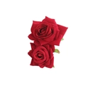 Detail shot of two realistic red velvet roses crafted for elegant vintage hair accessories - Red