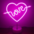 Pink heart and love neon lamp with Cupid arrow on a white round base and power cord - Cupid (Pink) With Base