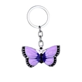 Vintage butterfly keychain with purple enamel wings and black crystal accents on white background - Purple