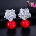 Detail of flower shaped earrings with white zircon stones and a large red pearl drop - Red Style (E0106-2)