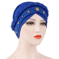 Detail of royal blue turban hat with twisted braided knot and golden beaded embellishments - Royal Blue