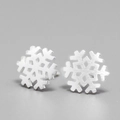 Macro detail of snowflake-shaped matte silver stud earrings with brushed metal texture - Brushed Snowflake Silver (JED156)