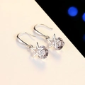 Detailed macro view of silver star earrings with brilliant cut sparkling zircon stones - Fish Hook Pentagram White Zircon (JED225)