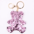 Pink sequin teddy bear keychain with golden metal ring and clip on white background - Bear - Pink