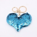 Close-up of heart-shaped blue sequin keychain with gold metal ring and lobster clasp - Heart Shape-Blue
