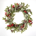 Frosted Christmas wreath with pine cones and red berries on a snowy pine base - 50cm