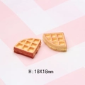 Detailed macro view of miniature resin waffles showing baked texture and 18x18mm size - Style H Fan-shaped Waffle