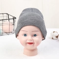 Gray knitted beanie for toddlers made of warm wool, shown on a baby mannequin head - Adjustable / Heather Grey