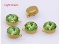 Detailed view of light green faceted glass pendants with gold claw settings and metal backing - Light Green