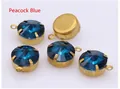Detailed view of peacock blue faceted round crystals with gold metal claw settings for DIY - Peacock Blue