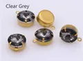 Close-up of transparent gray faceted glass crystals with gold metal claw settings for DIY - Smoke Gray