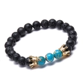 Bracciale corona in pietra lavica con diaspore imperiale blu e perline dorate su fondo bianco - Stile Pietra Vulcanica Pietra Blu