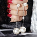 Dettaglio di orecchini a nappa lunga in argento con perle su pizzo nero elegante - Argento (Perno in argento)