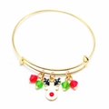 Detail of gold Christmas bangle with reindeer enamel charm and red green crystals - Deer