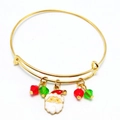 Detail of adjustable gold Christmas bracelet with Santa enamel charm and festive beads - Santa Claus