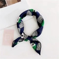 Close-up of silk scarf featuring navy blue artistic eye print and satin texture knot - 20 Green Hair Witch