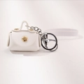 Mini white litchi grain PU leather pouch keychain with gold snap and white hand strap - White