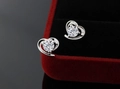 Macro shot of heart-shaped silver earrings with sparkling white zircon in red velvet box - White Zircon Heart (JED047)