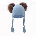 Detail of light blue knit baby hat featuring plush fur pom-poms and braided earflaps - Light Blue