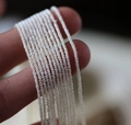 Macro shot of 4mm natural freshwater tiny pearls strands for handmade jewelry making - 2.5-3mm / White