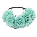 Close-up of mint green artificial rose flowers on a slim black bridal headband - Light Blue