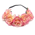 Detailed view of pink and yellow gradient faux roses on a flexible black elastic headband - Champagne with Rose Pink Edge