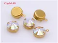Macro view of five round white AB crystal glass pendants with brass claw settings - AB White
