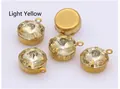 Macro detail of light yellow round crystal gems with gold metal loop claw settings - Light Yellow
