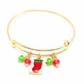 Detailed view of golden Christmas bangle with red stocking charm and colorful glass beads - Christmas Stocking