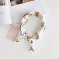 White silk square scarf with delicate brown feather print tied in a soft decorative knot - 5 White Feather