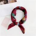 Detail of burgundy silk scarf with floral pattern and knot style on white background - 19 Woodpecker Red