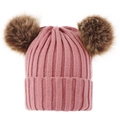Detail of pink knitted baby hat featuring two large brown faux fur pom poms on top - S / Dusky Pink