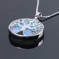Silver tree of life hollow necklace with light blue opal stone on a black background - Opalite With Chain