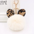 Creamy white plush pompom keychain with leopard print ears and a golden ring holder - Gold Key Chain Style / Off-white