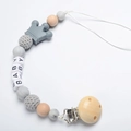 Baby pacifier clip with grey crown and wooden beads spelling BABY on a white background - Gray
