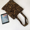Flat lay of leopard print canvas tote bag next to a tablet for size reference - Corduroy Leopard Shoulder Bag