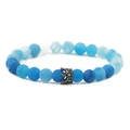 Macro shot of blue weathered stone beads and a gun-grey crown charm on the bracelet - Gun Black Weathered Stone