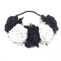 Detailed top view of black and white fabric roses on a bridal flower headband - White + Black