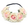 Detail of faux roses on a black elastic headband featuring yellow and pink gradient petals - Cream with Pink Center