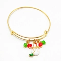 Detail of a Christmas snowman charm bracelet with gold finish and colorful beads - Snowman