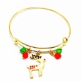 Detail of Christmas bangle featuring a golden reindeer charm with red and green beads - Sika Deer