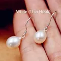 Macro detail of natural freshwater drop pearl earring with S925 sterling silver hook - Fine Hook / White